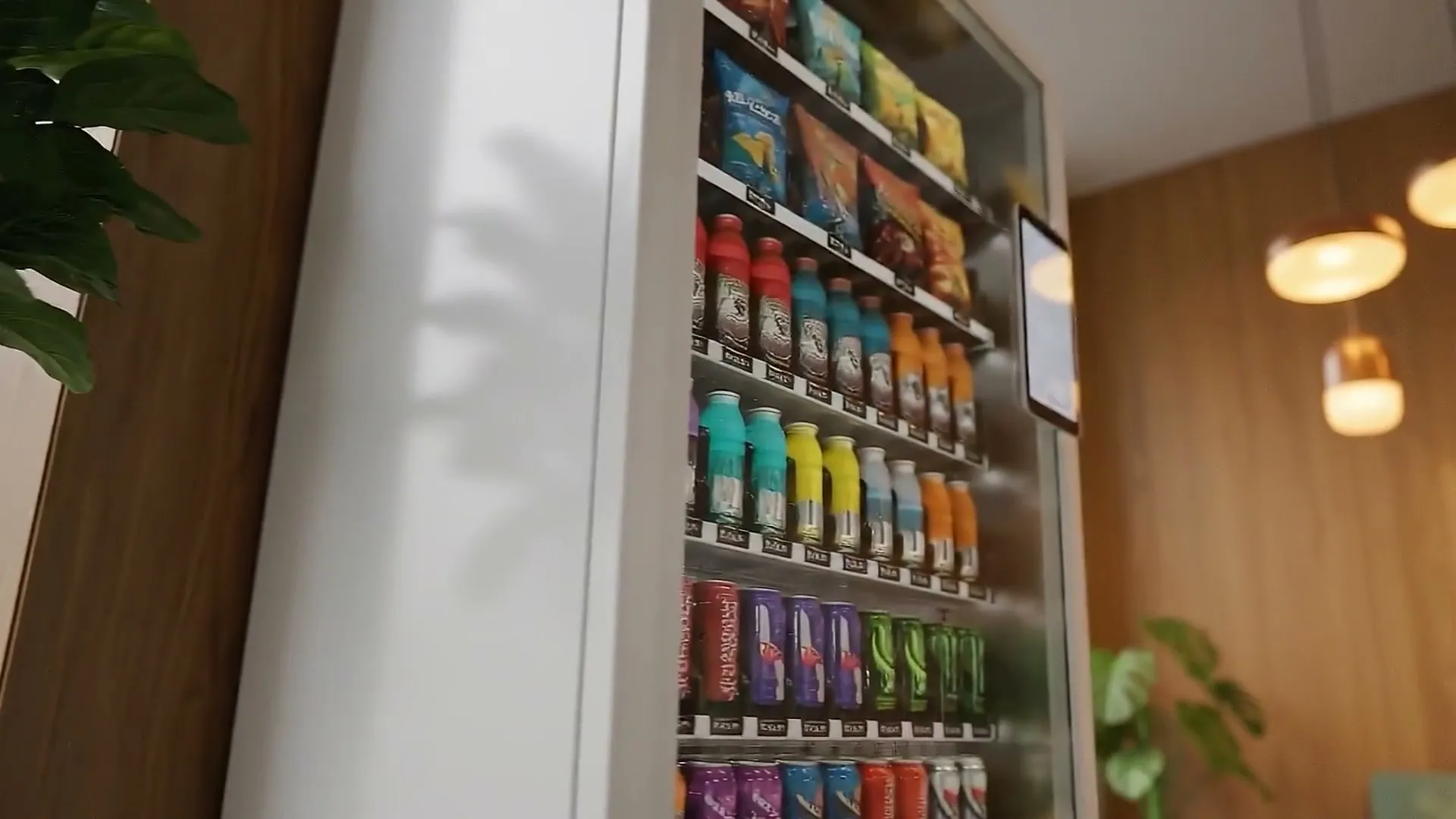 Close-up of Orion 10 shelves stocked with snacks and bottled drinks