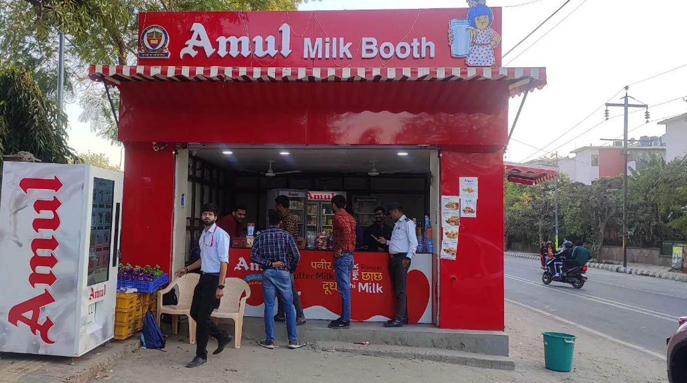 A single modern vending machine in a clean Indian office break area