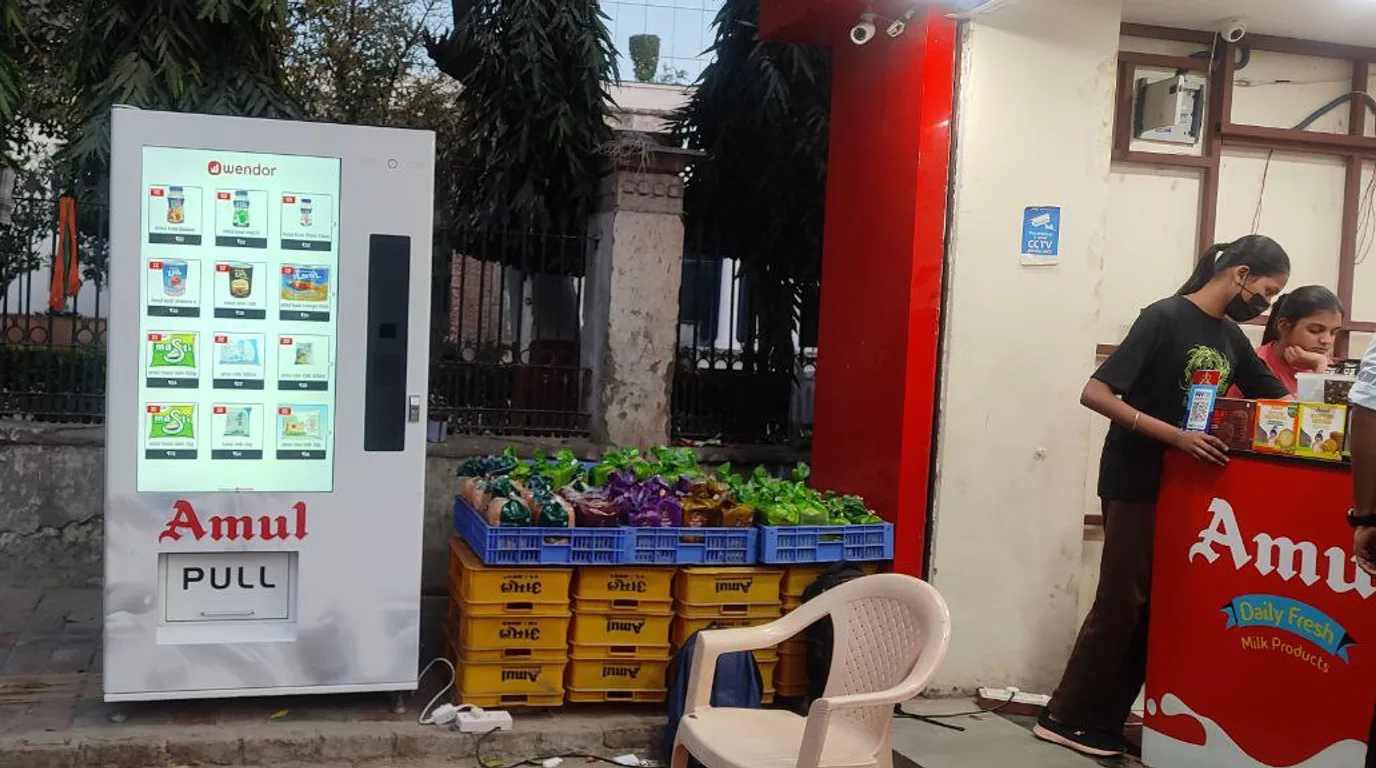 Still life comparing a vending machine model against other passive income symbols