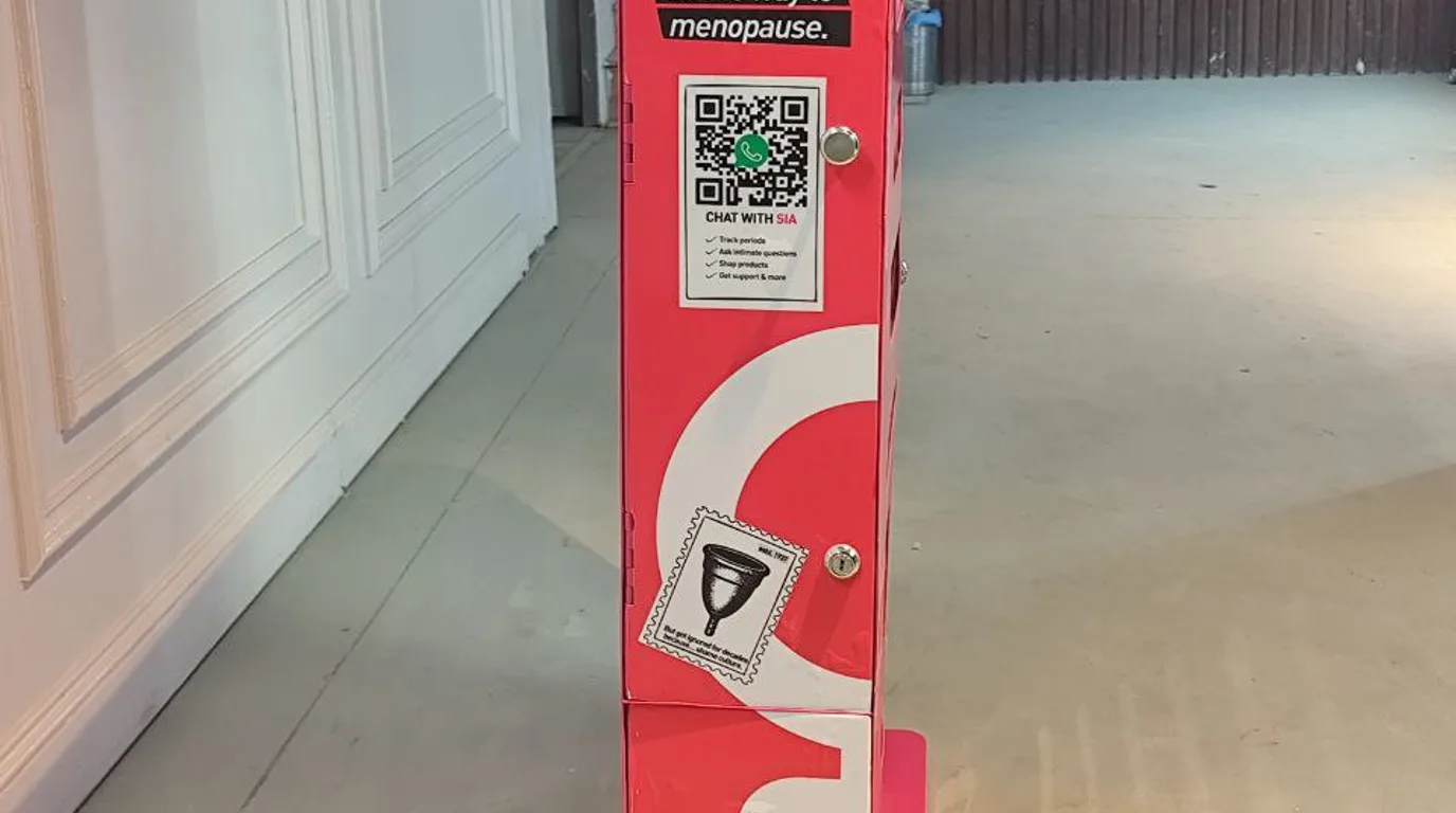 Person troubleshooting a declined tap payment at a vending machine