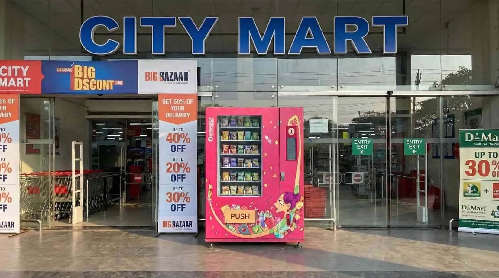 Pink Wendor vending machine installed outside a City Mart storefront