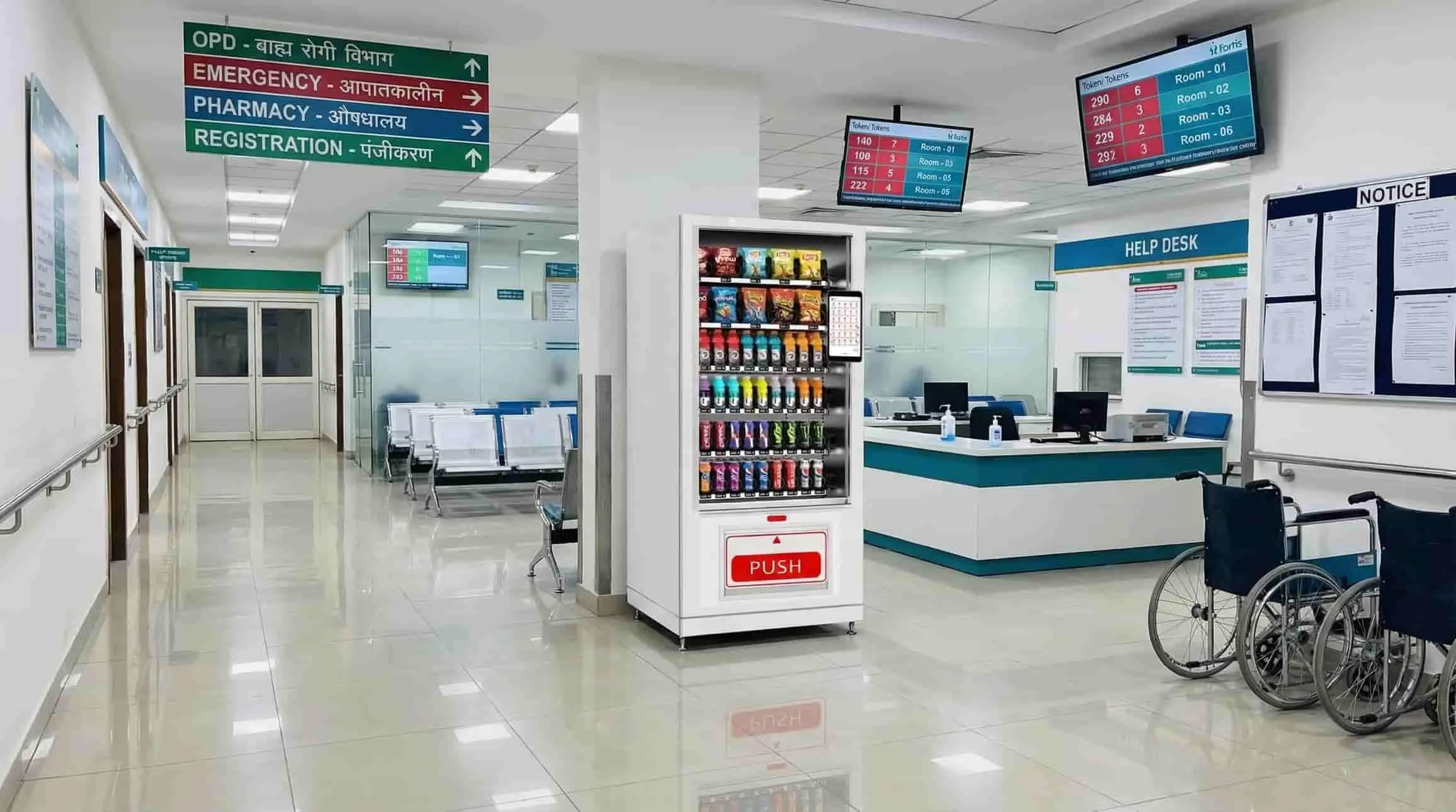 Wendor snack and drink vending machine in a hospital corridor near the help desk